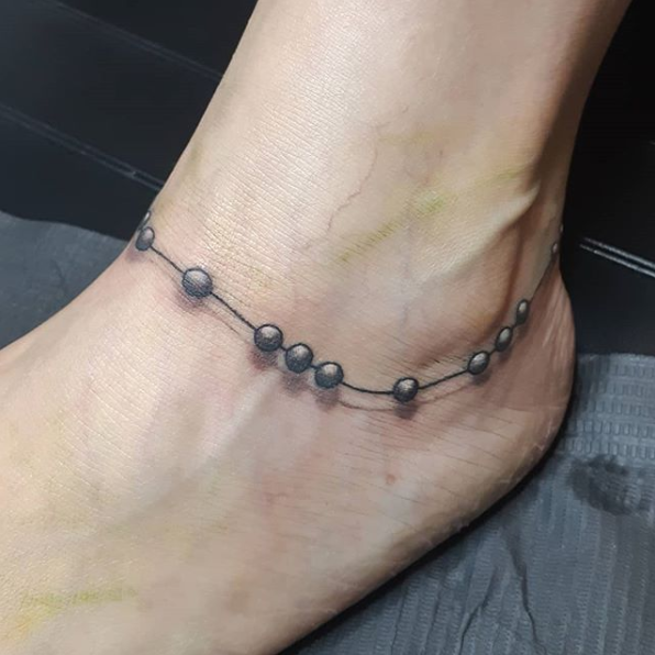 Ankle Beads — Clay Walker Tattoo